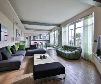 Salon de luxe spacieux et lumineux avec design contemporain, cuisine ouverte et vue dégagée. Parfait pour un appartement haut de gamme.